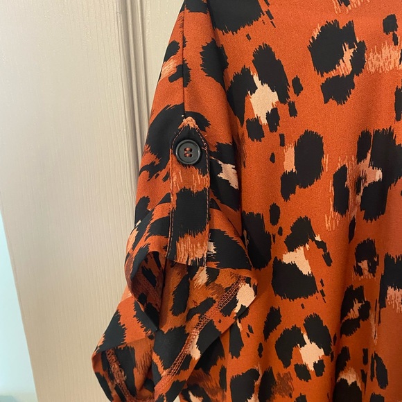 Sexy leopard top with cuffed button sleeves. Throw on and go. - Picture 2 of 4